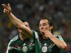 Mexico's defender Andres Guardado celebrates after scoring the 0-2 during a Group A football match against Croatia on June 23, 2014