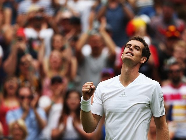 Andy Murray celebrates getting through the first round of Wimbledon on June 23, 2014.