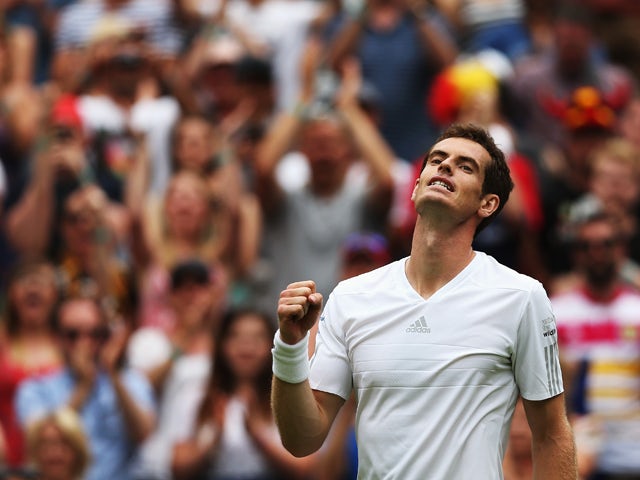 Andy Murray of Great Britain celebrates after winning his Gentlemen's Singles first round match against David Goffin of Belgium on day one of the Wimbledon Lawn Tennis Championships at the All England Lawn Tennis and Croquet Club at Wimbledon on June 23, 