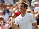 Andy Murray of Great Britain celebrates after winning his Gentlemen's Singles second round match against Blaz Rola of Slovenia on day three of the Wimbledon Lawn Tennis Championships at the All England Lawn Tennis and Croquet Club at Wimbledon on June 25,