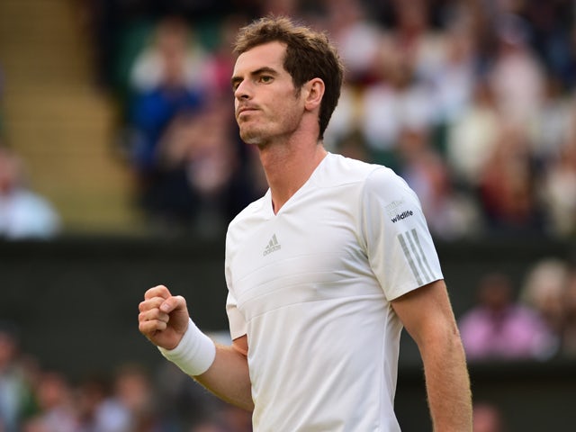 Britain's Andy Murray celebrates winning his men's singles third round match against Spain's Roberto Bautista Agut on day five of the 2014 Wimbledon Championships at The All England Tennis Club in Wimbledon, southwest London, on June 27, 2014