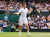 Andy Murray of Great Britain plays a forehand return during his Gentlemen's Singles third round match against Roberto Bautista Agut of Spain on day five of the Wimbledon Lawn Tennis Championships at the All England Lawn Tennis and Croquet Club on June 27,