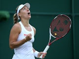Germany's Angelique Kerber celebrates after winning her women's singles third round match against Belgium's Kirsten Flipkins on day six of the 2014 Wimbledon Championships at The All England Tennis Club in Wimbledon, southwest London, on June 28, 2014