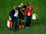 Anthony Vanden Borre of Belgium is helped off the pitch during the 2014 FIFA World Cup Brazil Group H match against South Korea on June 28, 2014