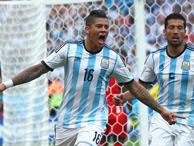 Marcos Rojo of Argentina celebrates scoring his team's third goal during the 2014 FIFA World Cup Brazil Group F match between Nigeria and Argentina at Estadio Beira-Rio on June 25, 2014
