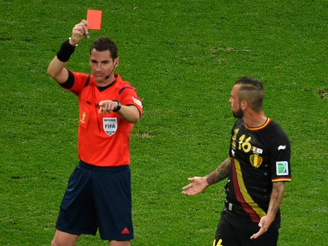 Belgium's midfielder Steven Defour is shown a red card by Australian referee Benjamin Jon Williams during a Group H football match between South Korea and Belgium at the Corinthians Arena in Sao Paulo during the 2014 FIFA World Cup on June 26, 2014