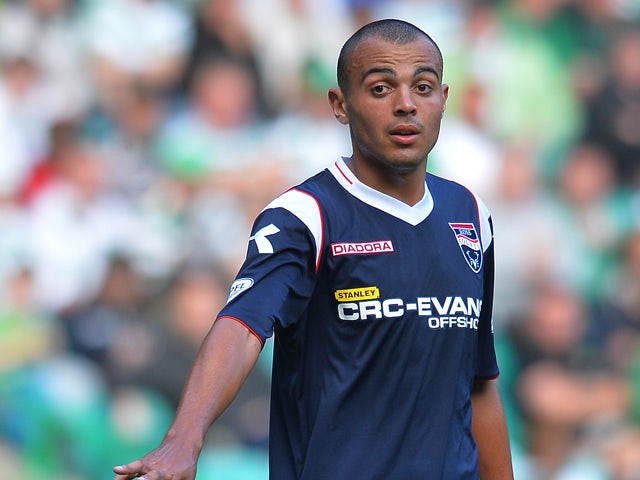 Ben Gordon of Ross County in action during the Scottish Premier League game between Celtic and Ross County at Celtic Park Stadium on August 03, 2013