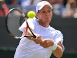 Slovenia's Blaz Rola returns against Britain's Andy Murray during their men's singles second round match on June 25, 2014