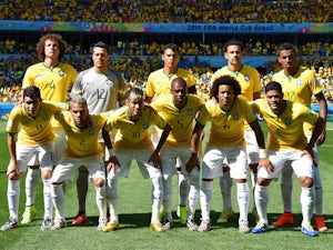 The Brazilian team line up before the game with Chile on June 28, 2014