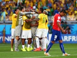 Julio Cesar of Brazil celebrates with teammates after defeating Chile in a penalty shootout during the 2014 FIFA World Cup Brazil round of 16 match between Brazil and Chile at Estadio Mineirao on June 28, 2014