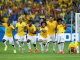 Brazil players celebrate their penalty shootout victory over Chile in the World Cup round of 16 in Belo Horizonte on June 28, 2014