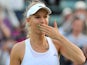 Denmark's Caroline Wozniacki blows a kiss as she celebrates beating Britain's Naomi Broady in their women's singles second round match on day three of the 2014 Wimbledon Championships on June 25, 2014