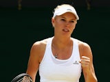 Caroline Wozniacki of Denmark celebrates after winning her Ladies' Singles third round match against Ana Konjuh of Croatia on day five of the Wimbledon Lawn Tennis Championships at the All England Lawn Tennis and Croquet Club on June 27, 2014