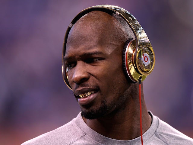 Chad Johnson (Ochocinco) #85 of the New England Patriots waits on the field during warmups before the New England Patriots take on the New York Giants in Super Bowl XLVI on February 5, 2012
