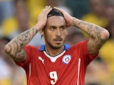 Chile's forward Mauricio Pinilla reacts after missing a shot on goal during extra-time of the Round of 16 football match between Brazil and Chile at the Mineirao Stadium in Belo Horizonte during the 2014 FIFA World Cup on June 28, 2014