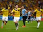James Rodriguez of Colombia celebrates scoring his team's second goal and his second of the game with teammates Jackson Martinez and Teofilo Gutierrez during the 2014 FIFA World Cup Brazil round of 16 match between Colombia and Uruguay at Maracana on June