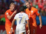 Holland's Daley Blind and Ron Vlaar argue with Chile's Alexis Sanchez on June 23, 2014.