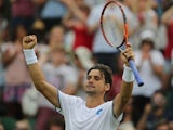 Spain's David Ferrer celebrates beating Spain's Pablo Carreno Busta during their men's singles first round match on day one of the 2014 Wimbledon Championships at The All England Tennis Club in Wimbledon, southwest London, on June 23, 2014
