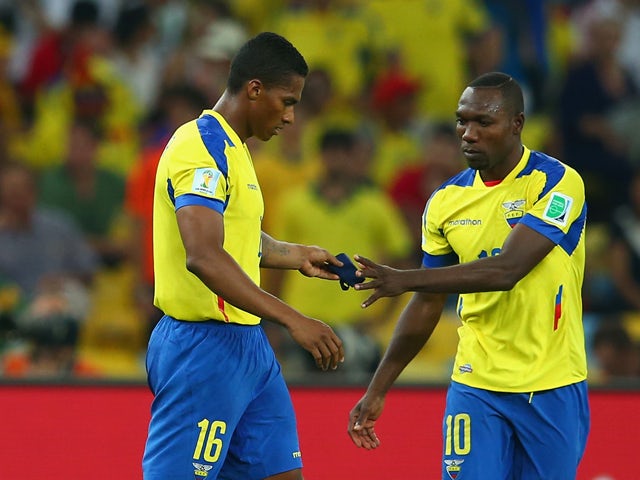 Antonio Valencia of Ecuador hands the captain's armband to Walter Ayovi after being sent off with a red card during the 2014 FIFA World Cup Brazil Group E match between Ecuador and France at Maracana on June 25, 2014