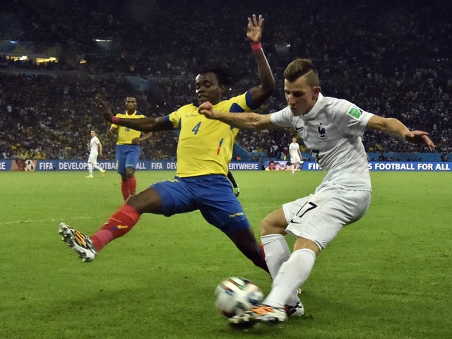 France's defender Lucas Digne in action against Ecuador's defender Juan Paredes during a Group E football match between Ecuador and France at the Maracana Stadium in Rio de Janeiro during the 2014 FIFA World Cup on June 25, 2014