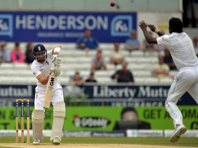 England's Joe Root plays a shot during the fifth and final days play in the second Test cricket match between England and Sri Lanka at Headingley in Leeds, England on June 24, 2014