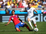  Luke Shaw of England is challenged by Bryan Ruiz of Costa Rica during the 2014 FIFA World Cup Brazil Group D match between Costa Rica and England at Estadio Mineirao on June 24, 2014
