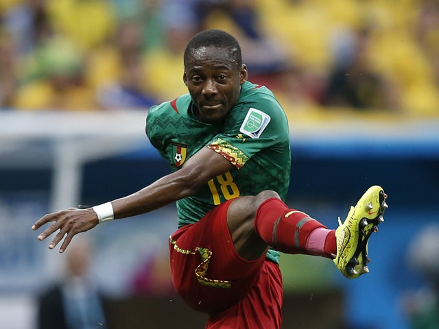 Cameroon's midfielder Enoh Eyong kicks the ball during the Group A football match between Cameroon and Brazil at the Mane Garrincha National Stadium in Brasilia during the 2014 FIFA World Cup on June 23, 2014