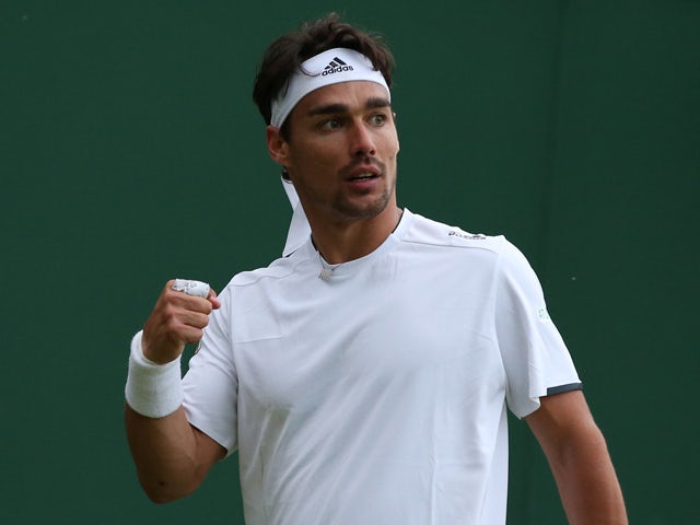 Italy's Fabio Fognini celebrates beating US player Alex Kuznetsov during their men's singles first round match on day one of the 2014 Wimbledon Championships at The All England Tennis Club in Wimbledon, southwest London, on June 23, 2014