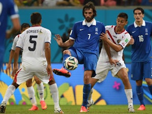 Greece's forward Georgios Samaras vies with Costa Rica's midfielder Celso Borges and Costa Rica's defender Oscar Duarte during a Round of 16 football match between Costa Rica and Greece at Pernambuco Arena in Recife during the 2014 FIFA World Cup on June 