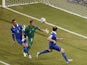 Costa Rica's goalkeeper Keylor Navas prepares to make a save as Greece's forward Kostas Mitroglou and defender Vasilis Torosidis try to score during the round of 16 football match between Costa Rica and Greece at Pernambuco Arena in Recife during the 2014