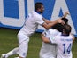 Greece's players celebrate after scoring a goal during the Group C football match between Greece and Ivory Coast at the Castelao Stadium in Fortaleza during the 2014 FIFA World Cup on June 24, 2014