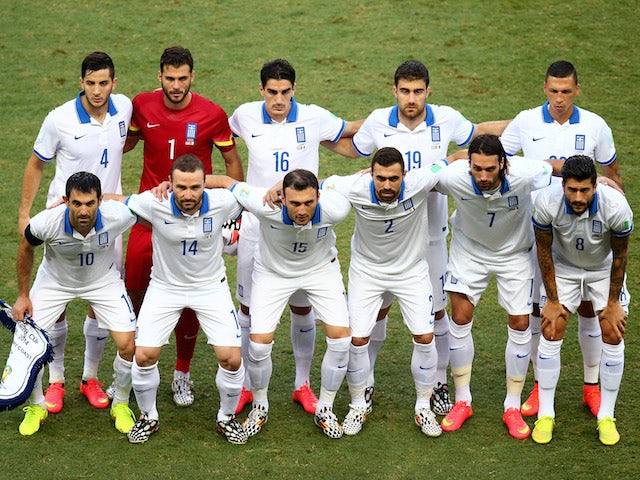 Greece pose for a team photo prior to the 2014 FIFA World Cup Brazil Group C match between Greece and the Ivory Coast at Castelao on June 24, 2014