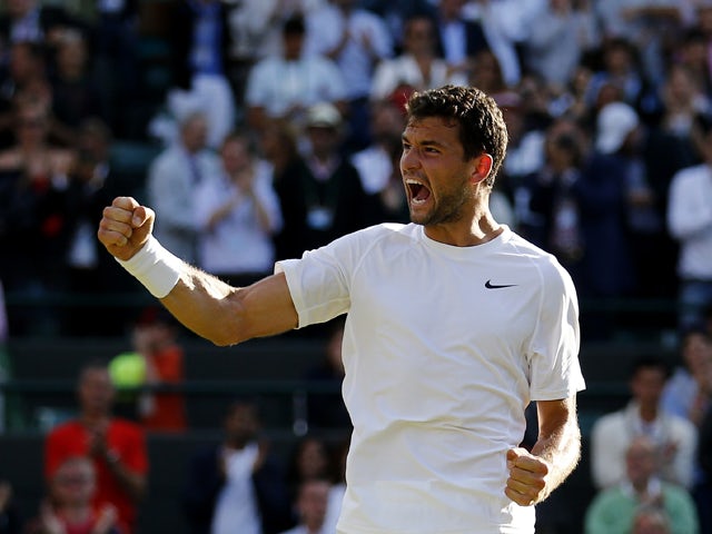 Bulgaria's Grigor Dimitrov celebrates winning against Ukraine's Alexandr Dolgopolov during their men's singles third round match on day five of the 2014 Wimbledon Championships at The All England Tennis Club in Wimbledon, southwest London, on June 27, 201
