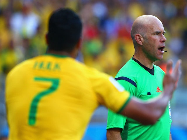 Hulk of Brazil appeals to assistant referee Michael Mullarkey after a disallowed goal and yellow card due to a hand ball during the 2014 FIFA World Cup on June 28, 2014