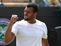 France's Jo-Wilfried Tsonga celebrates match point during his men's singles first round match against Austria's Jurgen Melzer, a day after the game was suspended due to rain, on day two of the 2014 Wimbledon Championships at The All England Tennis Club in