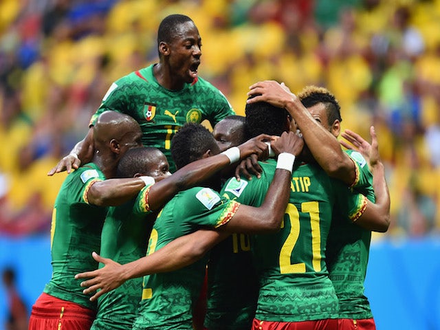 Joel Matip of Cameroon (R) celebrates scoring his team's first goal with teammates during the 2014 FIFA World Cup Brazil Group A match against Brazil on June 23, 2014