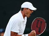 John Isner of the United States celebrates after winning his Gentlemen's Singles first round match against Daniel Smethurst of Great Britain on day two of the Wimbledon Lawn Tennis Championships at the All England Lawn Tennis and Croquet Club at Wimbledon