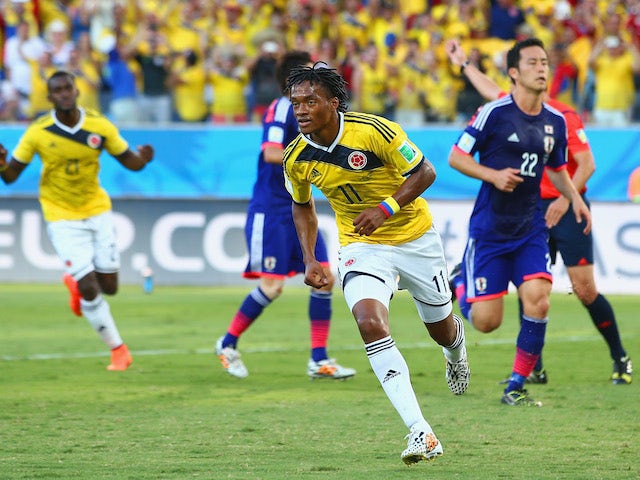 Juan Guillermo Cuadrado of Colombia celebrates scoring his team's first goal after a penalty kick during the 2014 FIFA World Cup Brazil Group C match against Japan on June 24, 2014