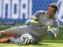 Brazil's goalkeeper Julio Cesar makes a save during the round of 16 football match between Brazil and Chile at The Mineirao Stadium in Belo Horizonte during the 2014 FIFA World Cup on June 28, 2014