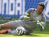 Brazil's goalkeeper Julio Cesar makes a save during the round of 16 football match between Brazil and Chile at The Mineirao Stadium in Belo Horizonte during the 2014 FIFA World Cup on June 28, 2014