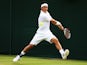 Kei Nishikori of Japan plays a backhand during his Gentlemen's Singles first round match against Kenny De Schepper of France on day two of the Wimbledon Lawn Tennis Championships at the All England Lawn Tennis and Croquet Club at Wimbledon on June 24, 201