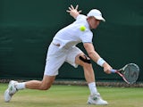 South Africa's Kevin Anderson returns against France's Edouard Roger-Vasselin during their men's singles second round match on day three of the 2014 Wimbledon Championships at The All England Tennis Club in Wimbledon, southwest London, on June 25, 2014
