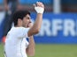 Uruguay forward Luis Suarez puts his hand to his mouth after clashing with Italy's defender Giorgio Chiellini during a Group D football match on June 24, 2014