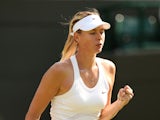Russia's Maria Sharapova reacts at match point during her women's singles first round match against Britain's Samantha Murray on day two of the 2014 Wimbledon Championships at The All England Tennis Club in Wimbledon, southwest London, on June 24, 2014