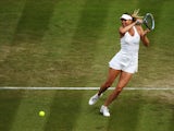  Maria Sharapova of Russia returns the ball during her Ladies' Singles second round match against Timea Bacsinszky of Switzerland on day four of the Wimbledon Lawn Tennis Championships at the All England Lawn Tennis and Croquet Club at Wimbledon on June 2