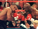 World Boxing Association heavyweight champion Evander Holyfield lands a right on challenger Mike Tyson during the first round of their fight in the MGM Grand Garden Arena 28 June, 1997