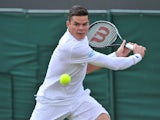 Canada's Milos Raonic returns against Australia's Matthew Ebden during their men's first round match on day two of the 2014 Wimbledon Championships at The All England Tennis Club in Wimbledon, southwest London, on June 24, 2014