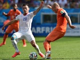 Netherlands' forward Arjen Robben vies with Chile's midfielder Charles Aranguiz during a Group B football match between Netherlands and Chile at the Corinthians Arena in Sao Paulo during the 2014 FIFA World Cup on June 23, 2014