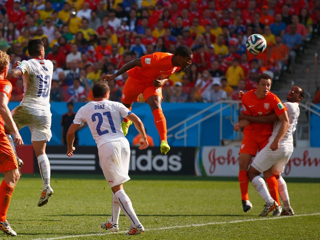Leroy Fer of the Netherlands scores his team's first goal on a header during the 2014 FIFA World Cup Brazil Group B match between the Netherlands and Chile at Arena de Sao Paulo on June 23, 2014
