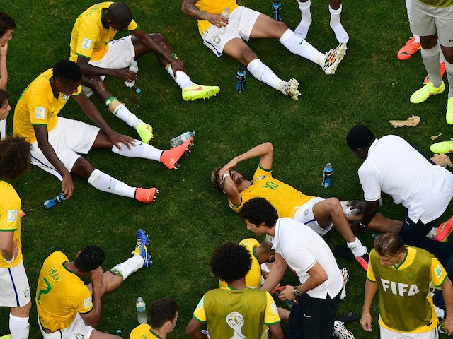 Brazil forward Neymar receives treatment prior to the start of extra time against Chile in the World Cup last-16 match in Belo Horizonte on June 28, 2014